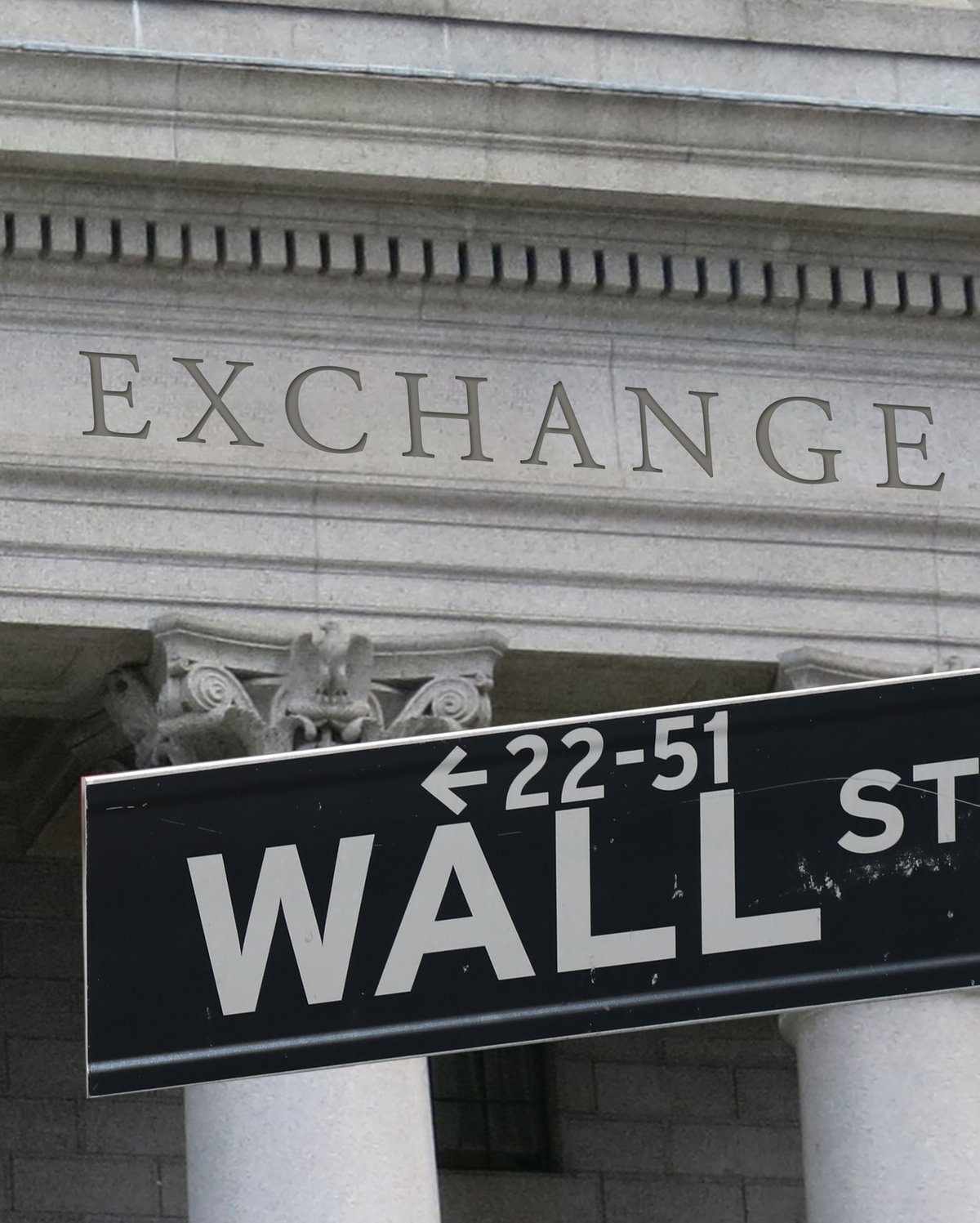 Wall Street street sign in front of the New York Stock Exchange